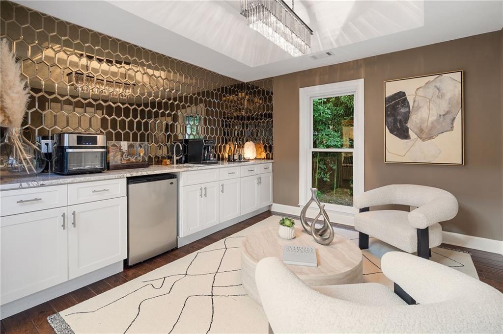 11260 Houze Road Roswell, GA 30076 - Photo 28 of 60 a kitchen with a sink and a stove top oven