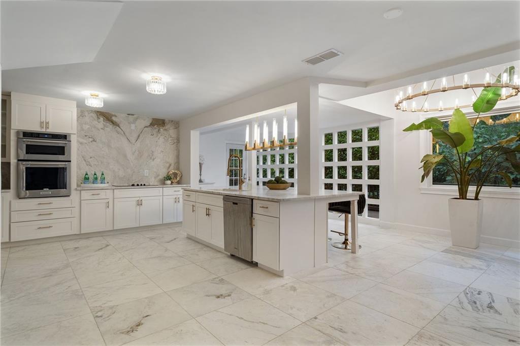 11260 Houze Road Roswell, GA 30076 - Photo 29 of 60 a kitchen with white cabinets and window