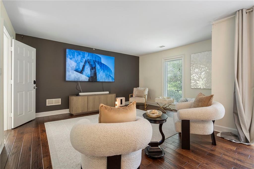 11260 Houze Road Roswell, GA 30076 - Photo 38 of 60 a living room with furniture and a large window