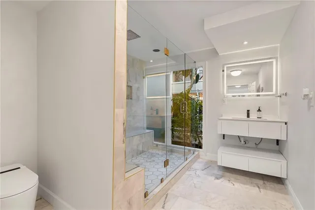 a bathroom with a bathtub and mirror