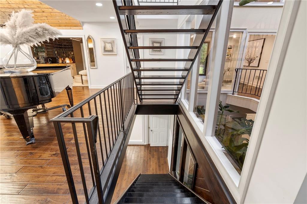 11260 Houze Road Roswell, GA 30076 - Photo 43 of 60 a view of staircase with railing and white walls