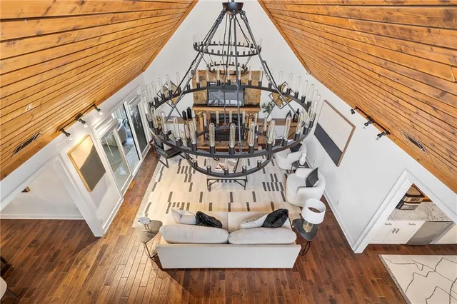 a living room with furniture and large windows