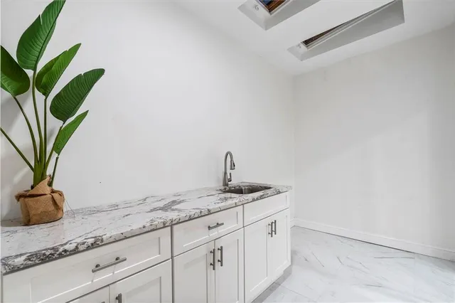 a room with a bed and a window