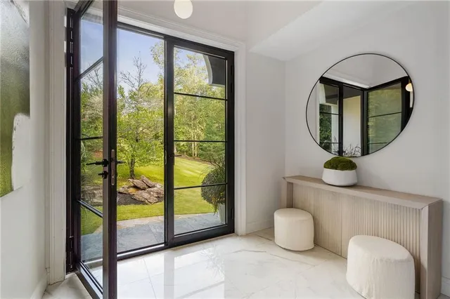 a view of a living room and kitchen floor