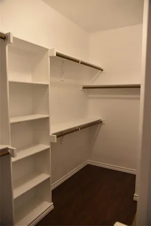 a view of an empty walk in closet