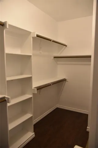 a view of an empty walk in closet
