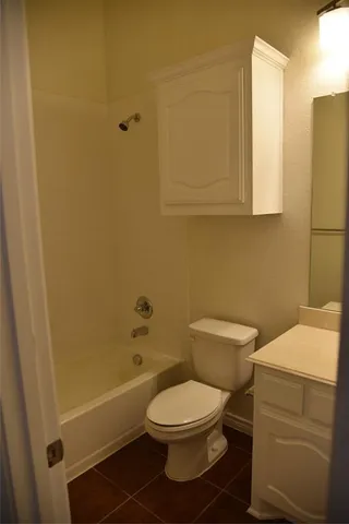 a bathroom with a toilet a sink and bathtub