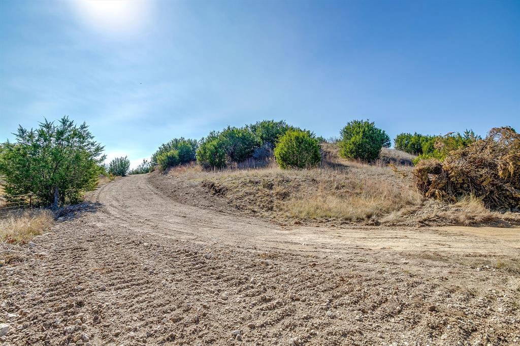 6267 Ben Day Murrin Road Fort Worth, TX 76126 - Photo 17 of 24 a view of a road with a yard
