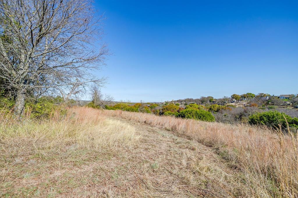 6267 Ben Day Murrin Road Fort Worth, TX 76126 - Photo 20 of 24 a view of lake with mountain in background