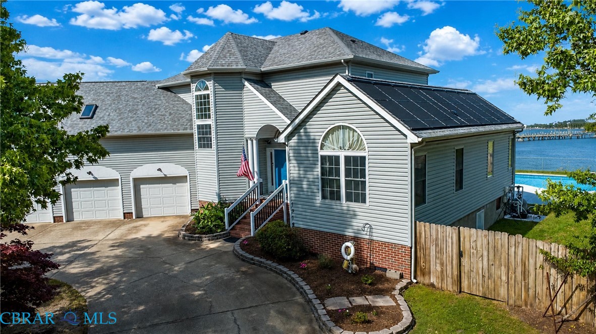 1214 Dandy Loop Road Yorktown, VA 23692 - Photo 9 of 65 a front view of a house with a yard