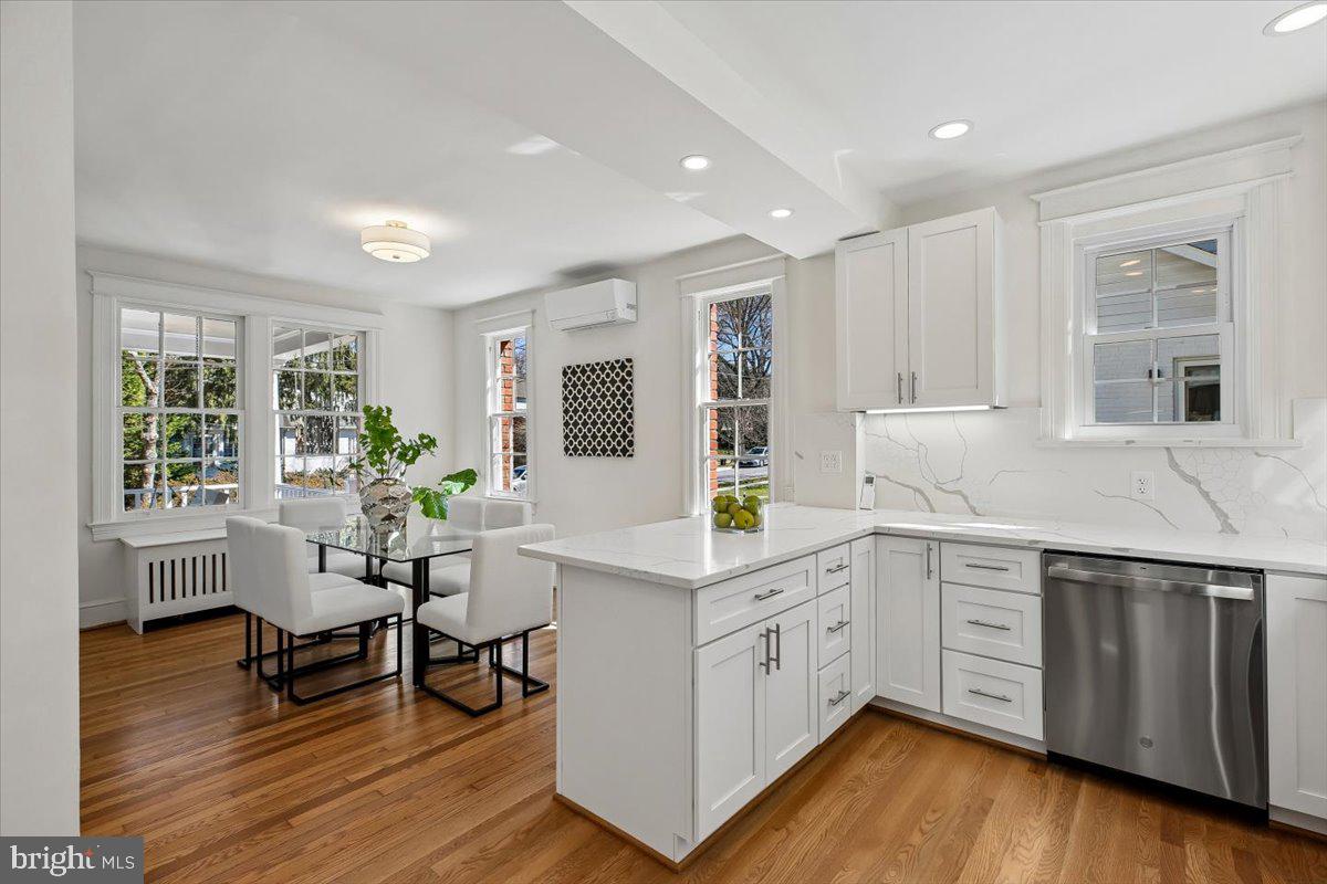 4714 Hunt Avenue Chevy Chase, MD 20815 - Photo 13 of 54 a kitchen with a sink cabinets and wooden floor