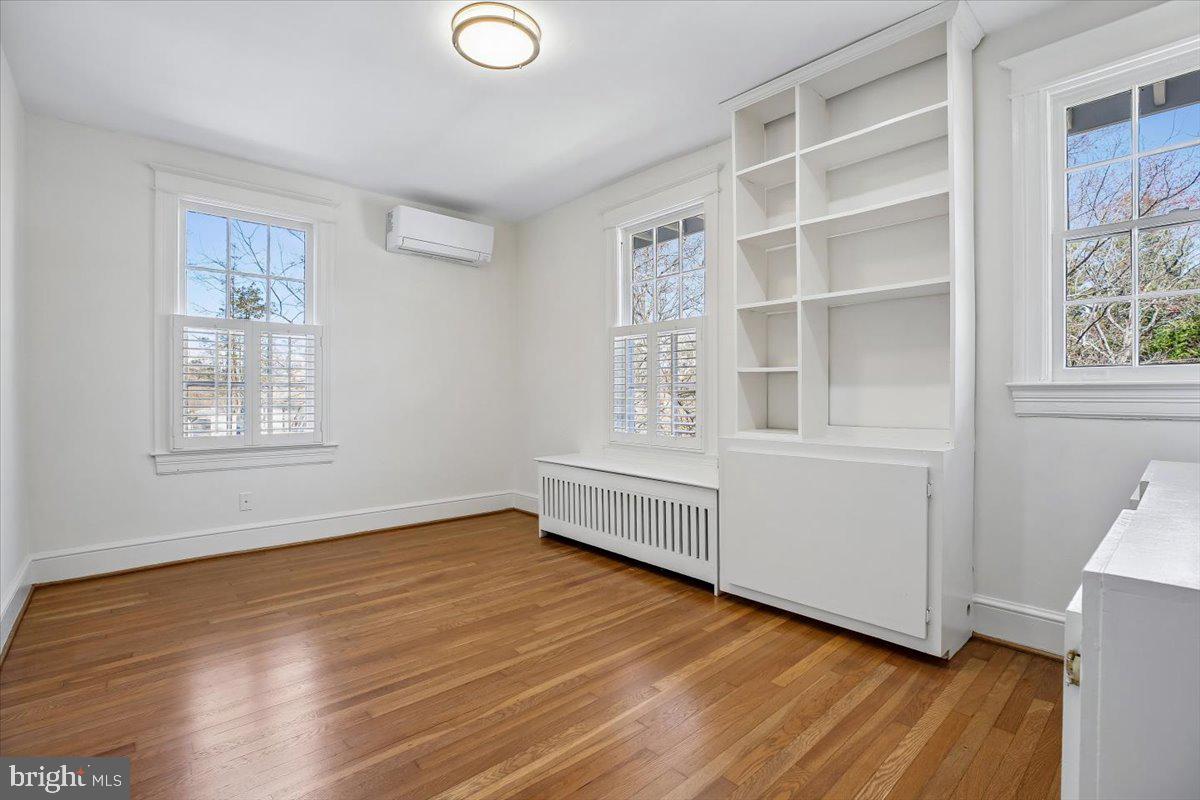 4714 Hunt Avenue Chevy Chase, MD 20815 - Photo 18 of 54 a view of an empty room with wooden floor and a window