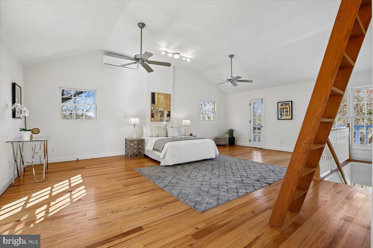 4714 Hunt Avenue Chevy Chase, MD 20815 - Photo 28 of 54 a bedroom with a bed rug and wooden floor