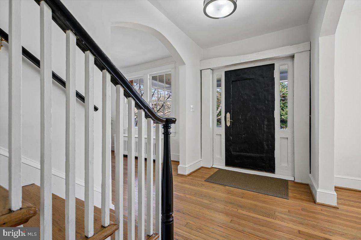 4714 Hunt Avenue Chevy Chase, MD 20815 - Photo 4 of 54 a view of an entryway with wooden floor and door
