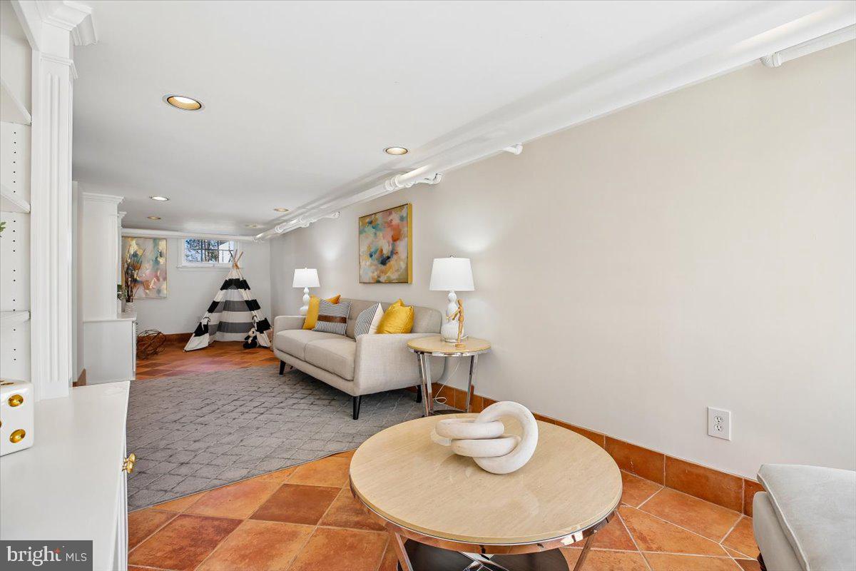 4714 Hunt Avenue Chevy Chase, MD 20815 - Photo 41 of 54 a living room with furniture and a wooden floor