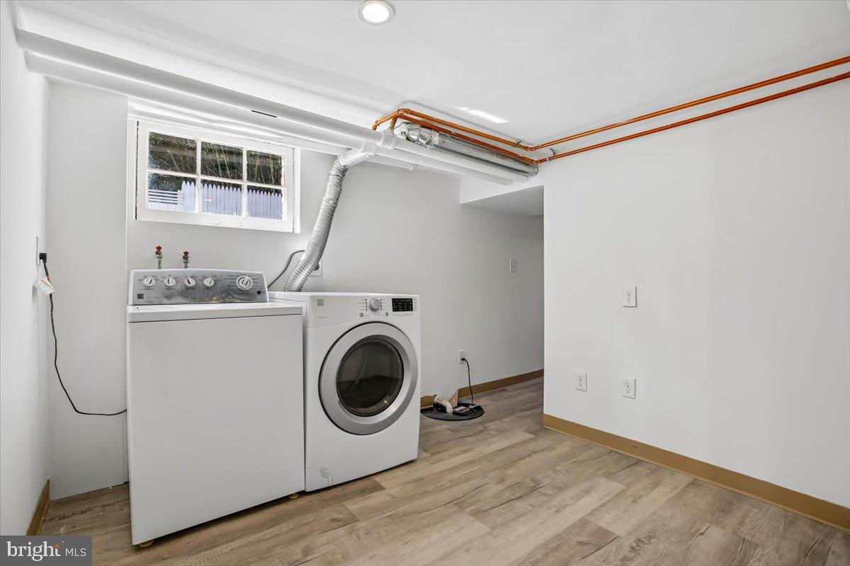 4714 Hunt Avenue Chevy Chase, MD 20815 - Photo 47 of 54 a utility room with dryer and washer