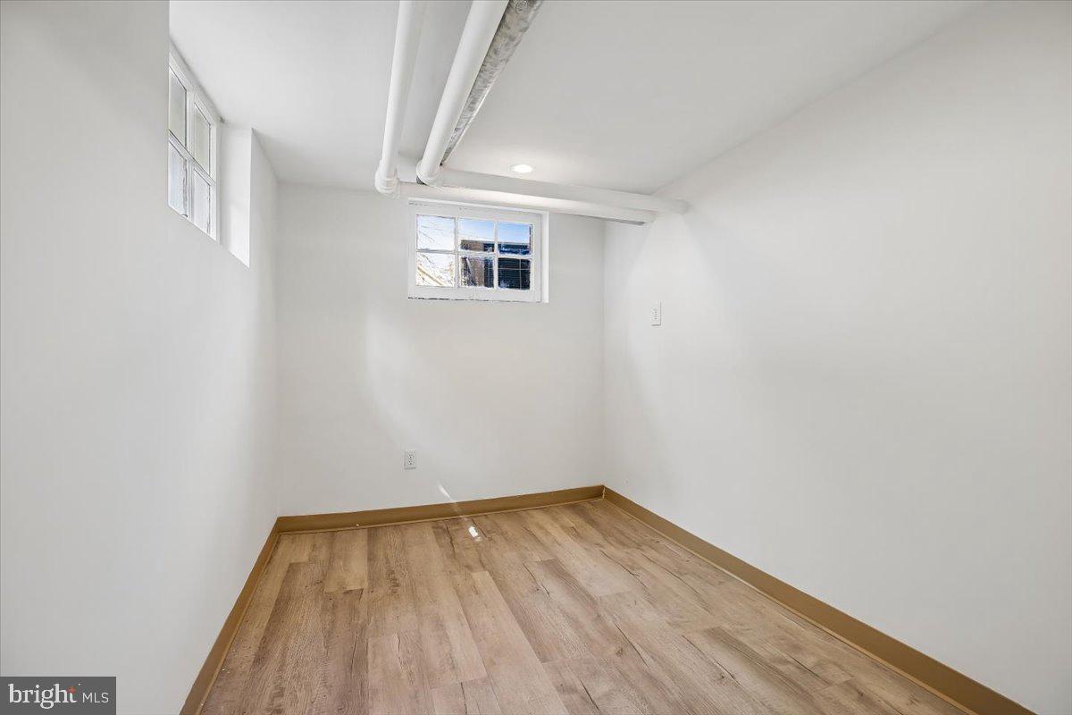 4714 Hunt Avenue Chevy Chase, MD 20815 - Photo 48 of 54 a view of a room with wooden floor and white walls