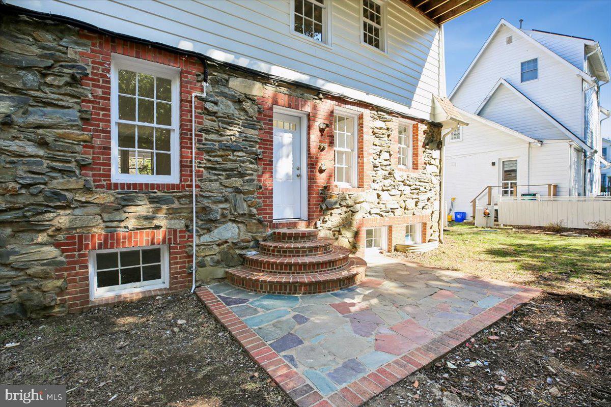 4714 Hunt Avenue Chevy Chase, MD 20815 - Photo 49 of 54 a front view of a house with a yard