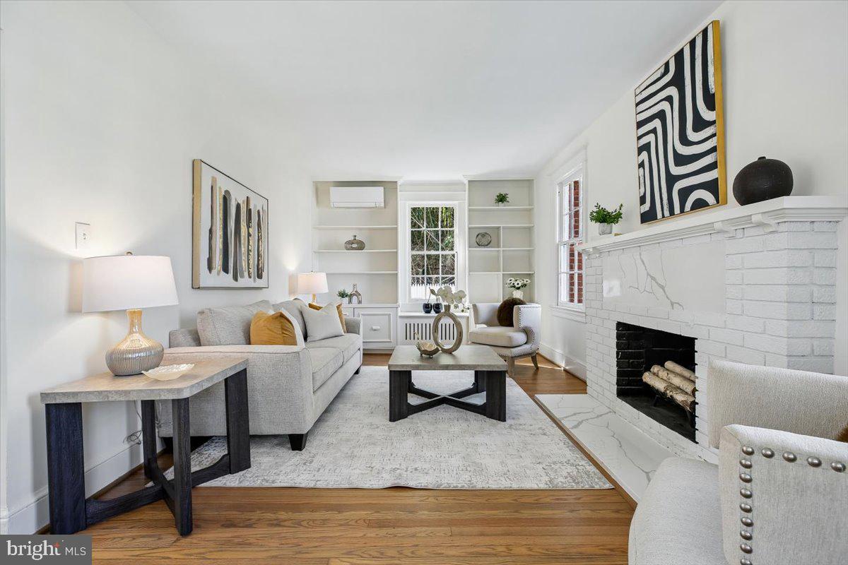 4714 Hunt Avenue Chevy Chase, MD 20815 - Photo 6 of 54 a living room with furniture and a fireplace