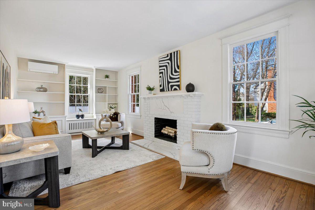 4714 Hunt Avenue Chevy Chase, MD 20815 - Photo 7 of 54 a living room with furniture and a fireplace