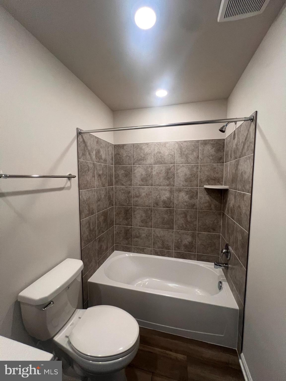 311 Sandy Btm Circle Ranson, WV 25438 - Photo 12 of 33 a bathroom with a toilet bathtub and shower