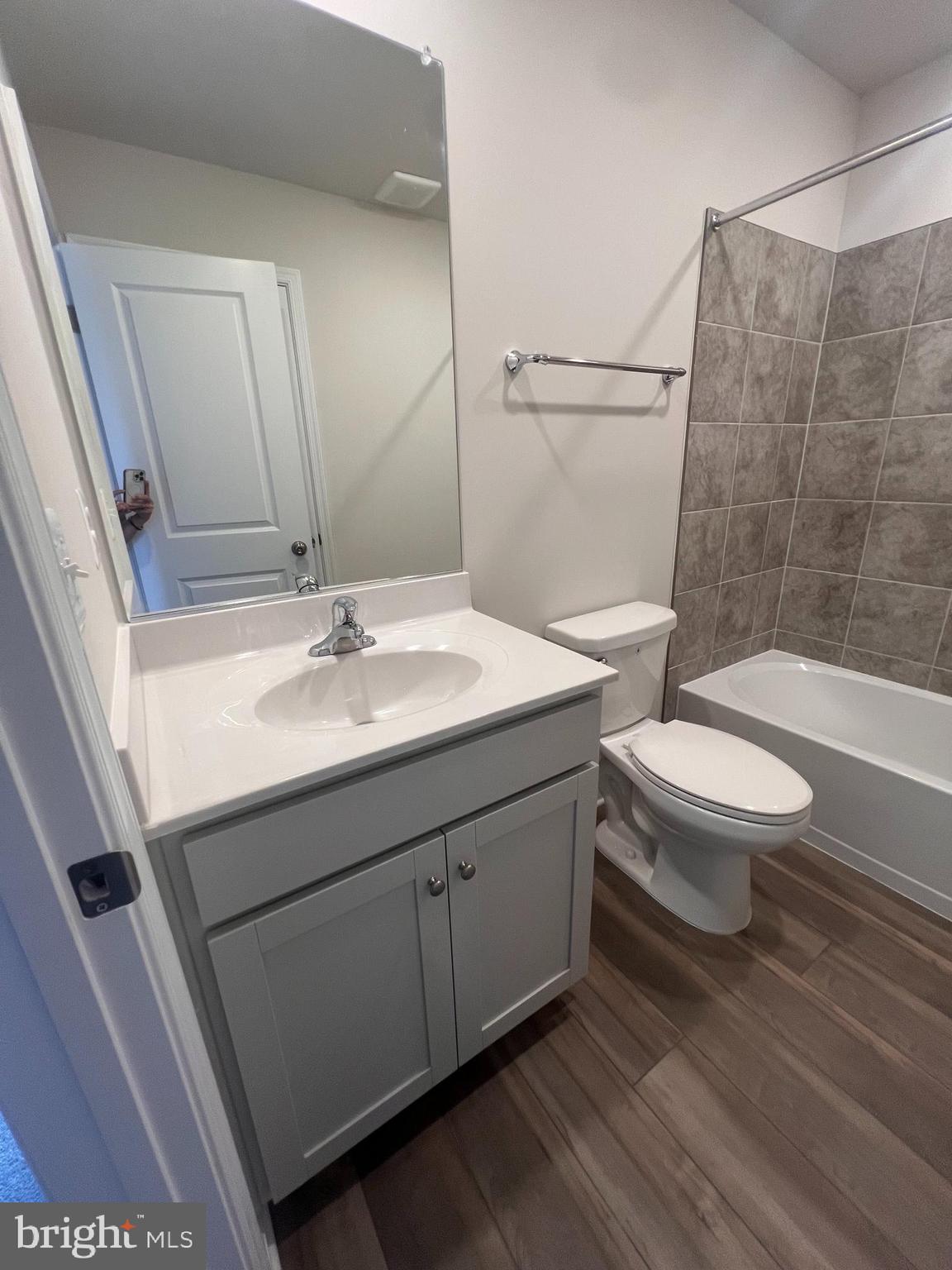 311 Sandy Btm Circle Ranson, WV 25438 - Photo 13 of 33 a bathroom with a sink a toilet and shower