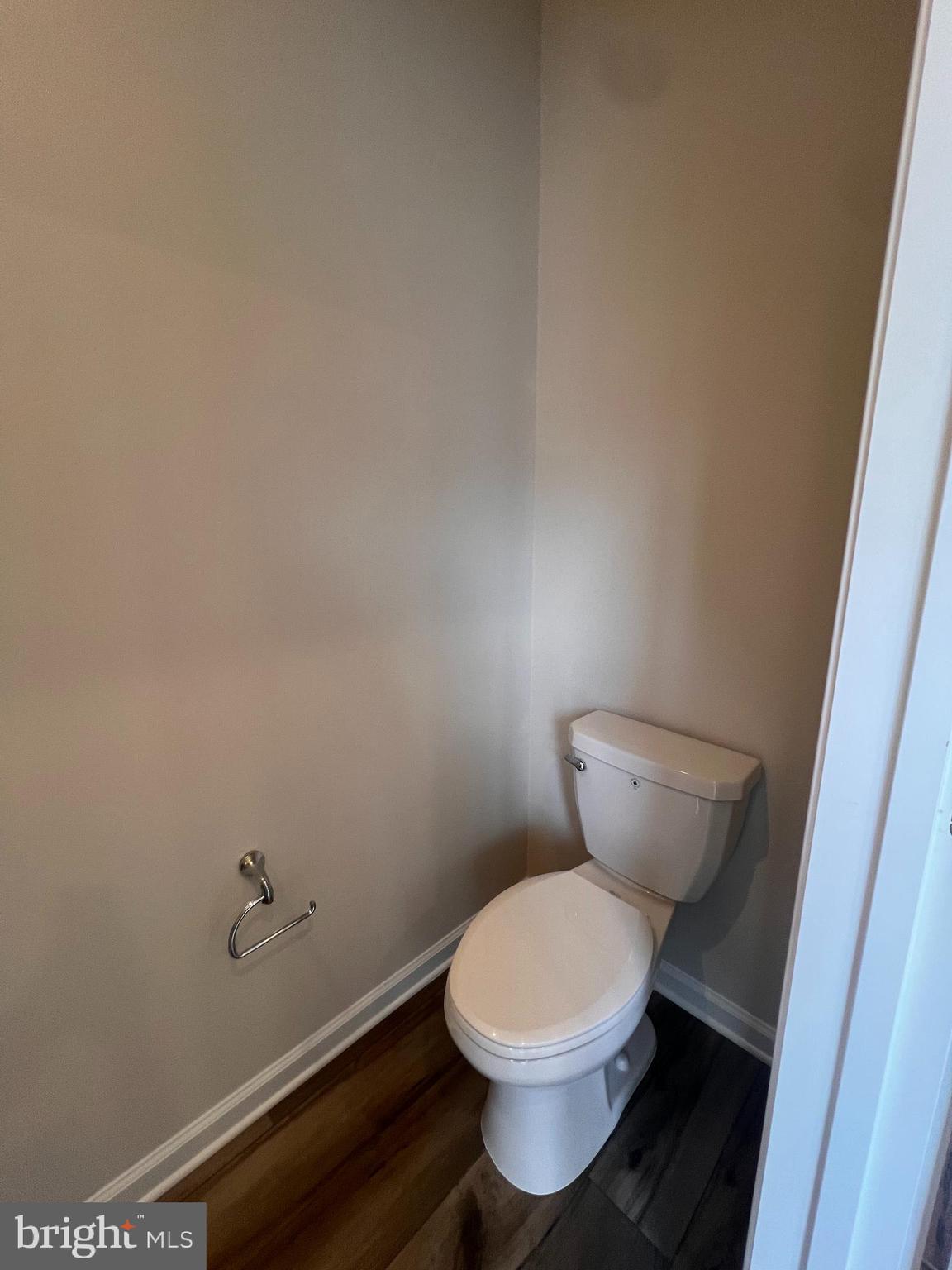 311 Sandy Btm Circle Ranson, WV 25438 - Photo 20 of 33 a white toilet sitting next to a white cabinet