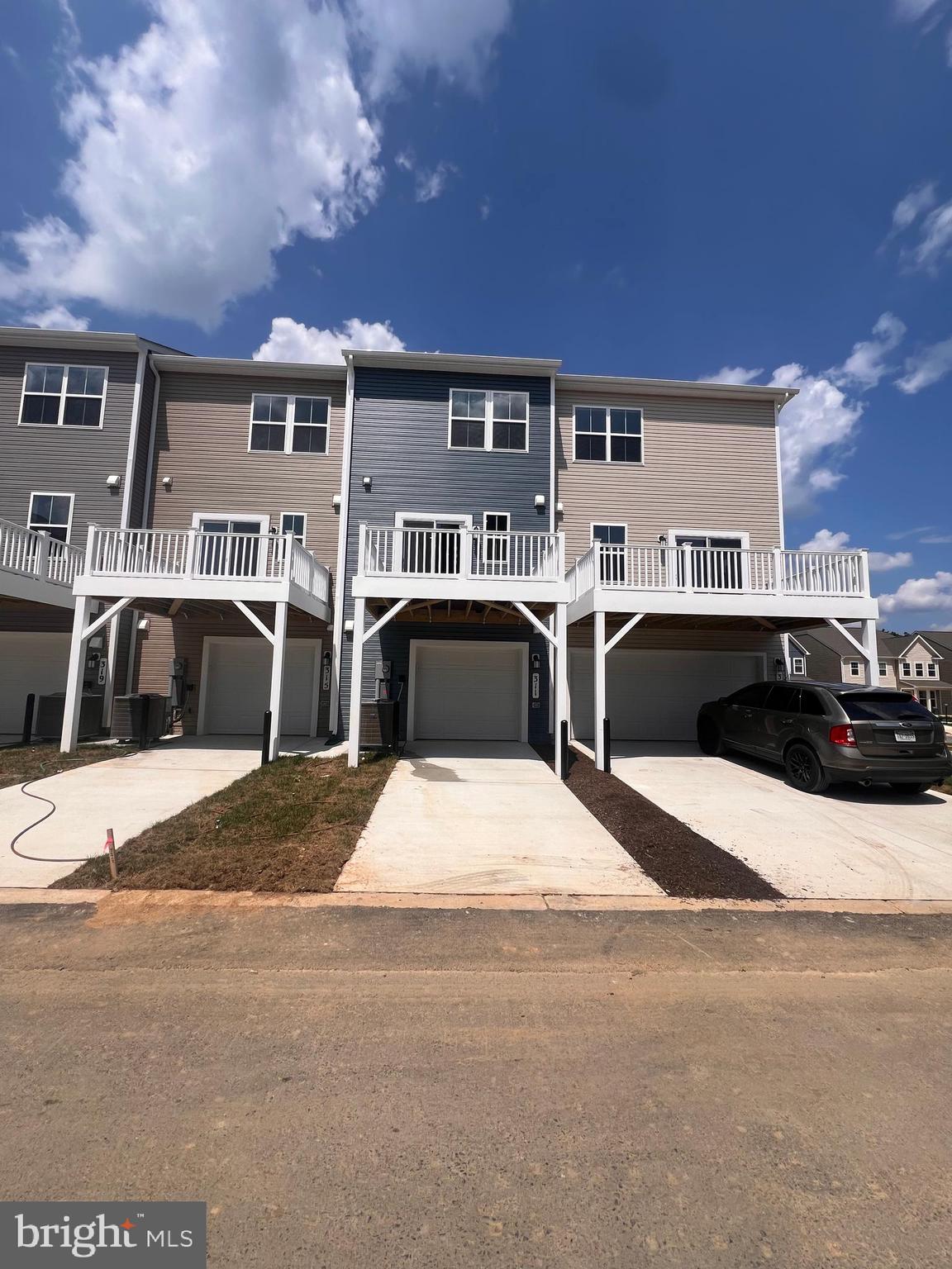 311 Sandy Btm Circle Ranson, WV 25438 - Photo 3 of 33 a view of a car park in front of house