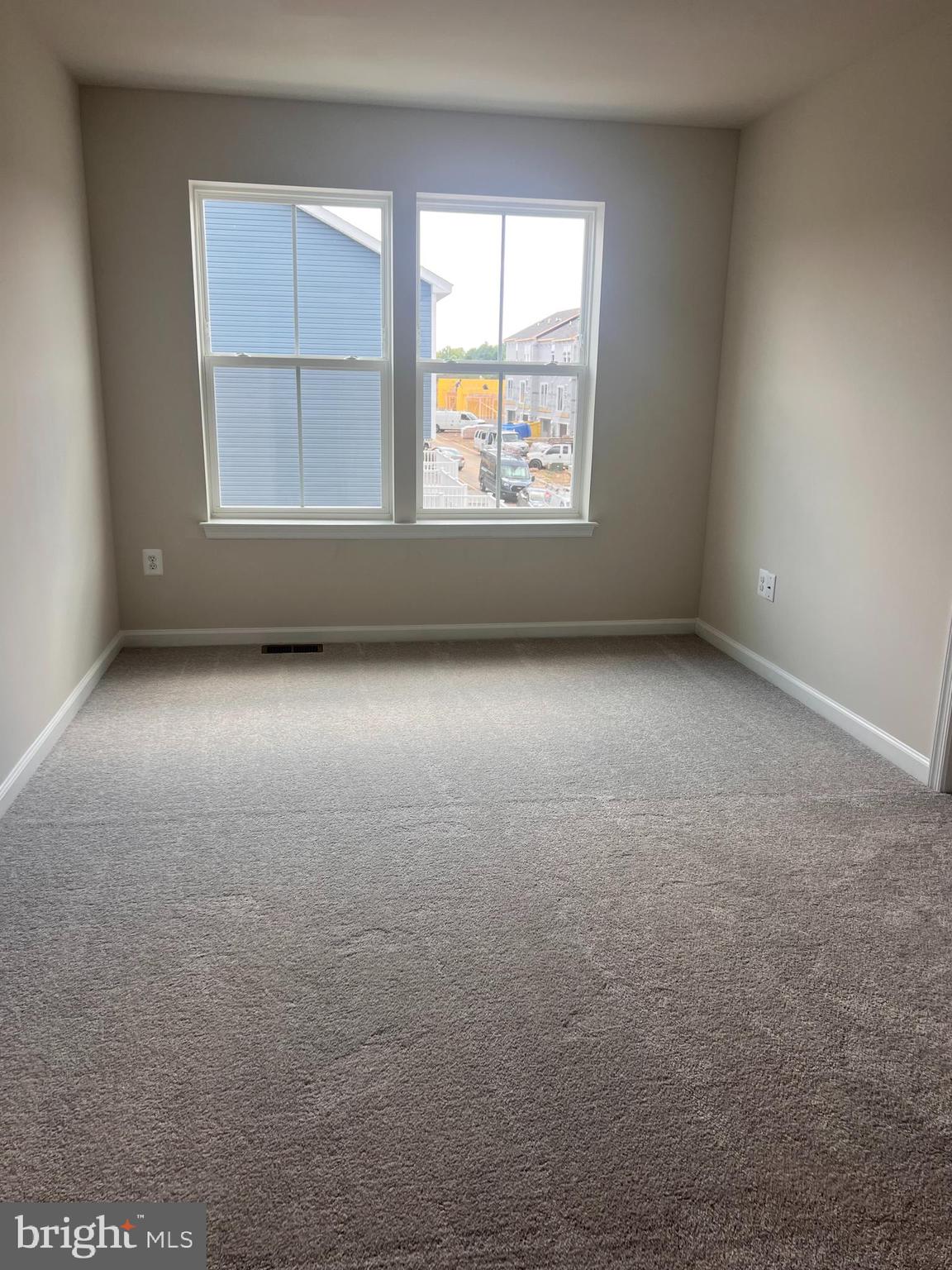 311 Sandy Btm Circle Ranson, WV 25438 - Photo 7 of 33 an empty room with a window