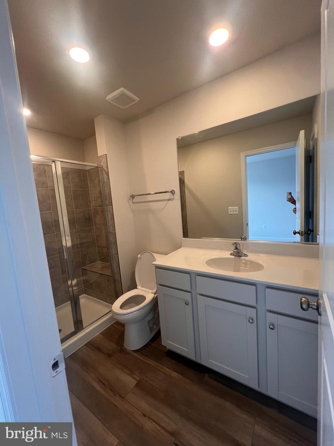 311 Sandy Btm Circle Ranson, WV 25438 - Photo 9 of 33 a bathroom with a double vanity sink toilet and shower