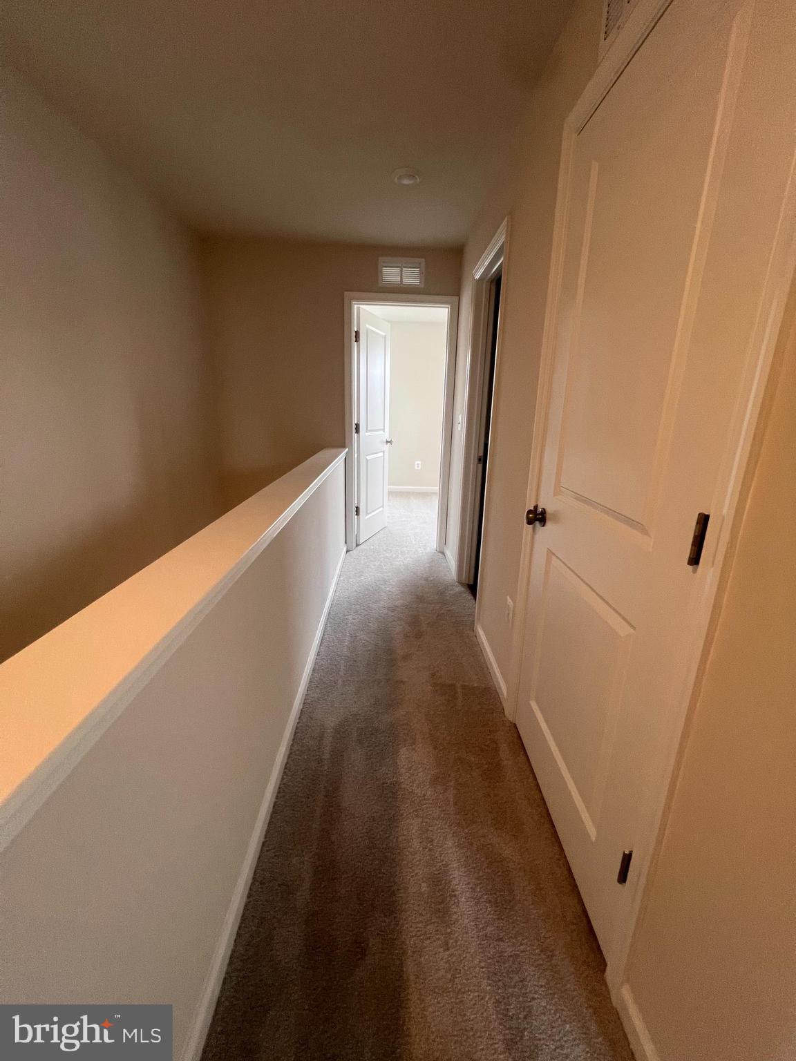 311 Sandy Btm Circle Ranson, WV 25438 - Photo 10 of 33 a view of a hallway with wooden floor