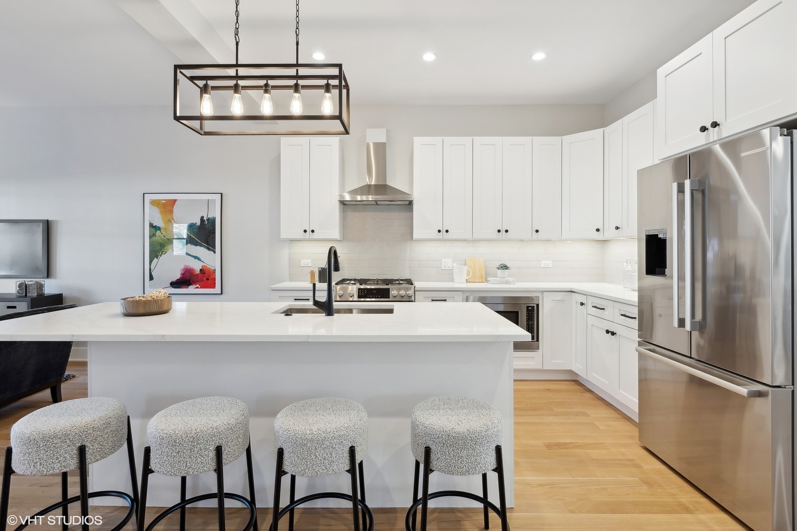 3414 North Tripp Avenue Chicago, IL 60641 - Photo 12 of 38 a kitchen with stainless steel appliances a sink stove refrigerator and cabinets