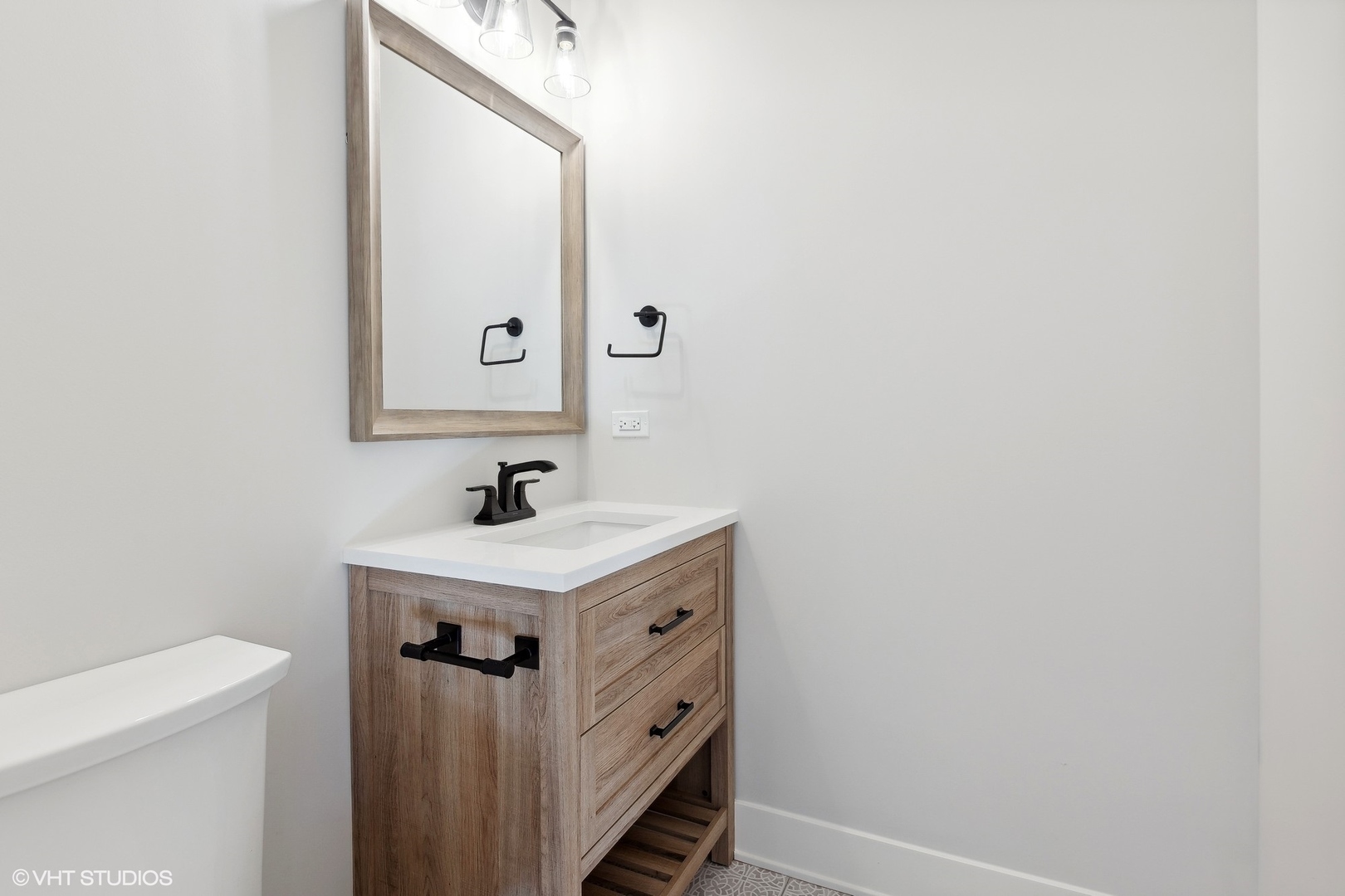 3414 North Tripp Avenue Chicago, IL 60641 - Photo 16 of 38 a bathroom with a sink a mirror and a toilet