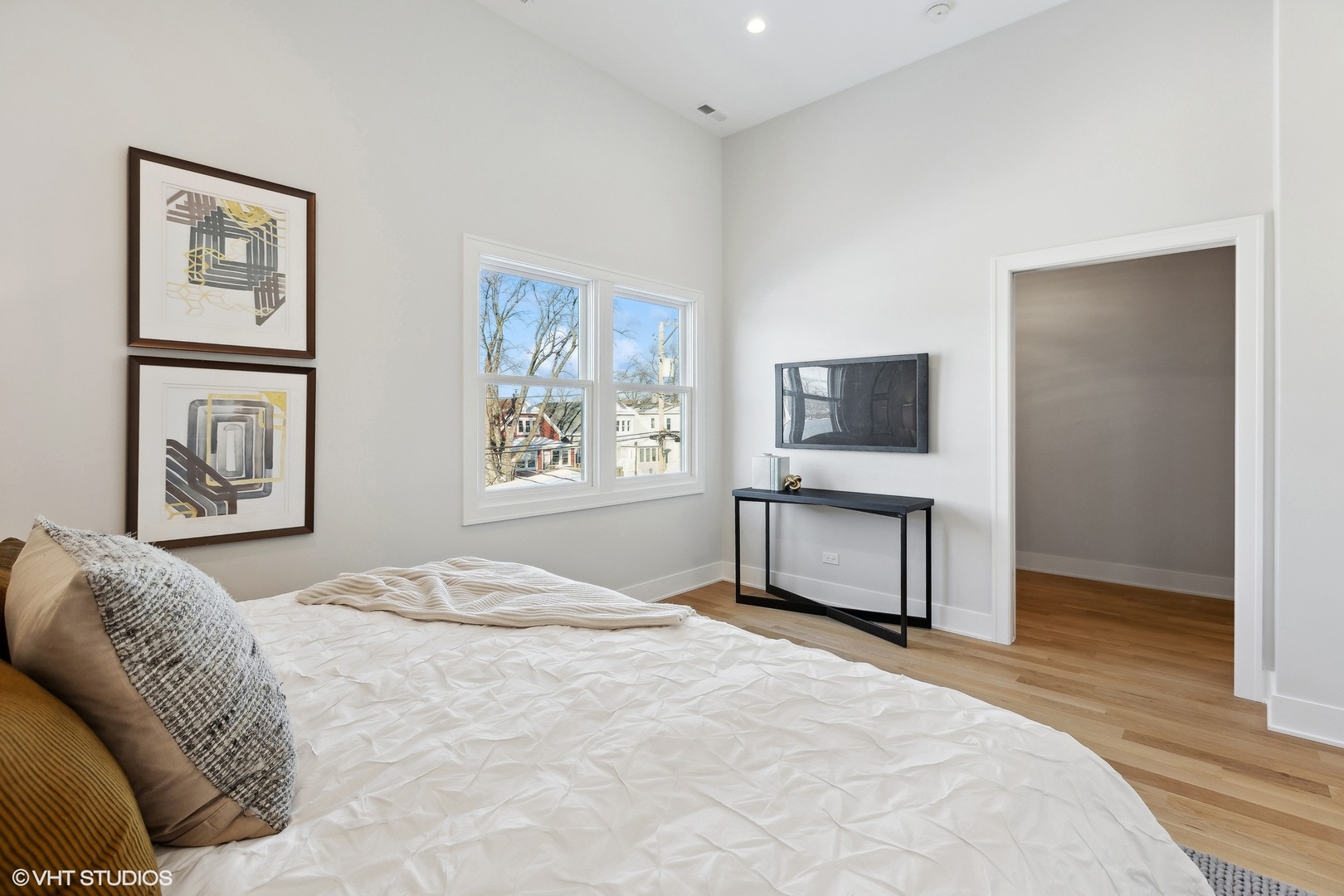 3414 North Tripp Avenue Chicago, IL 60641 - Photo 20 of 38 a bedroom with a bed and a tv on the dresser