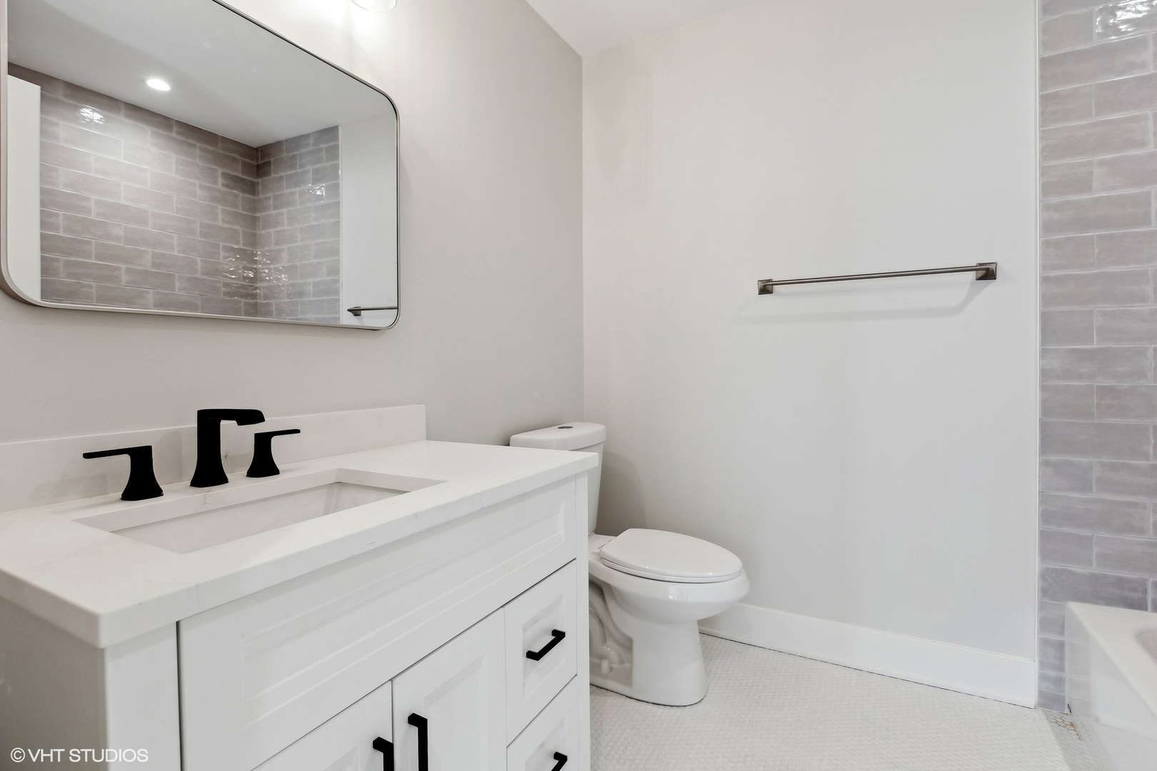 3414 North Tripp Avenue Chicago, IL 60641 - Photo 24 of 38 a bathroom with a sink a toilet and a mirror