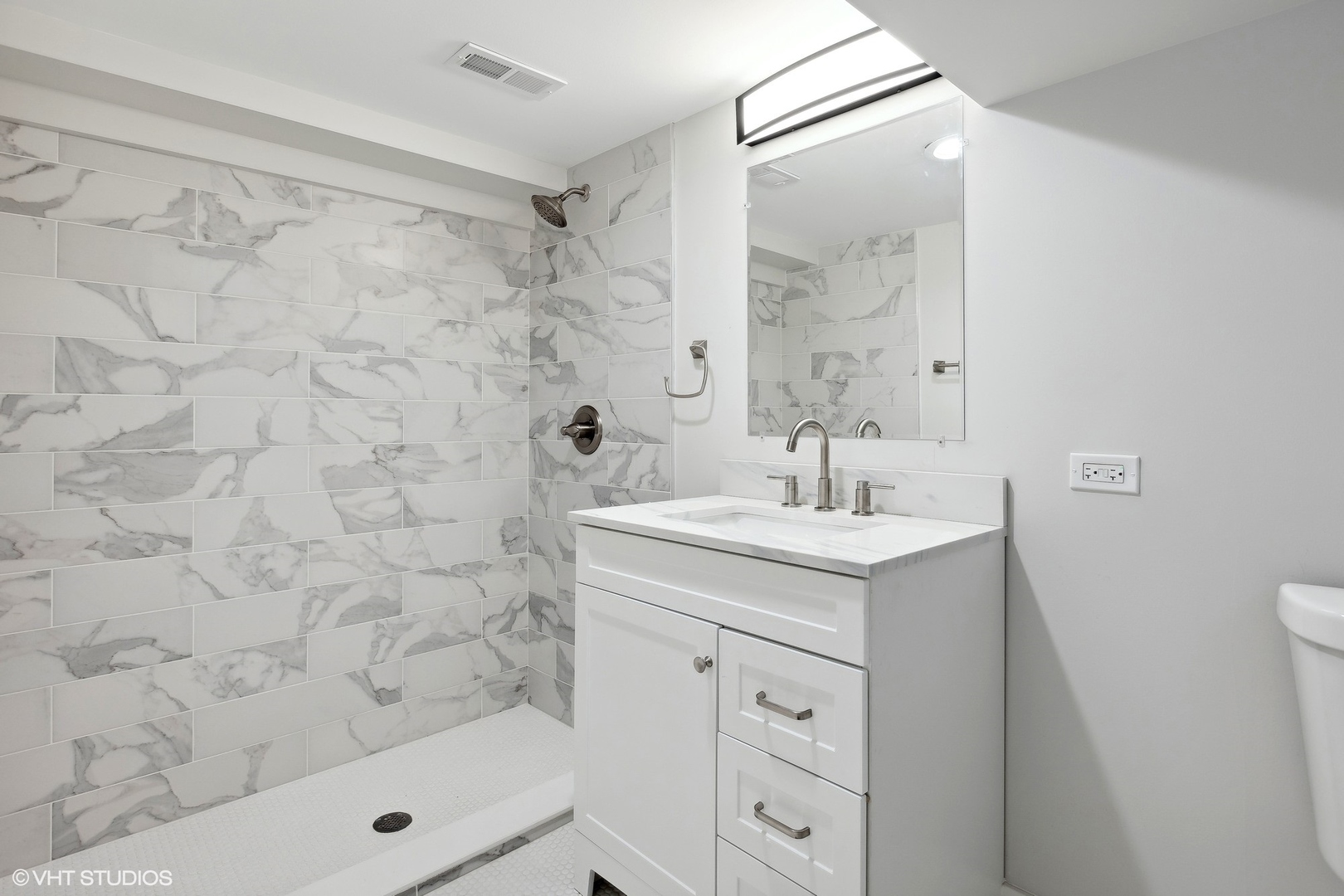 3414 North Tripp Avenue Chicago, IL 60641 - Photo 30 of 38 a bathroom with a sink a toilet and shower