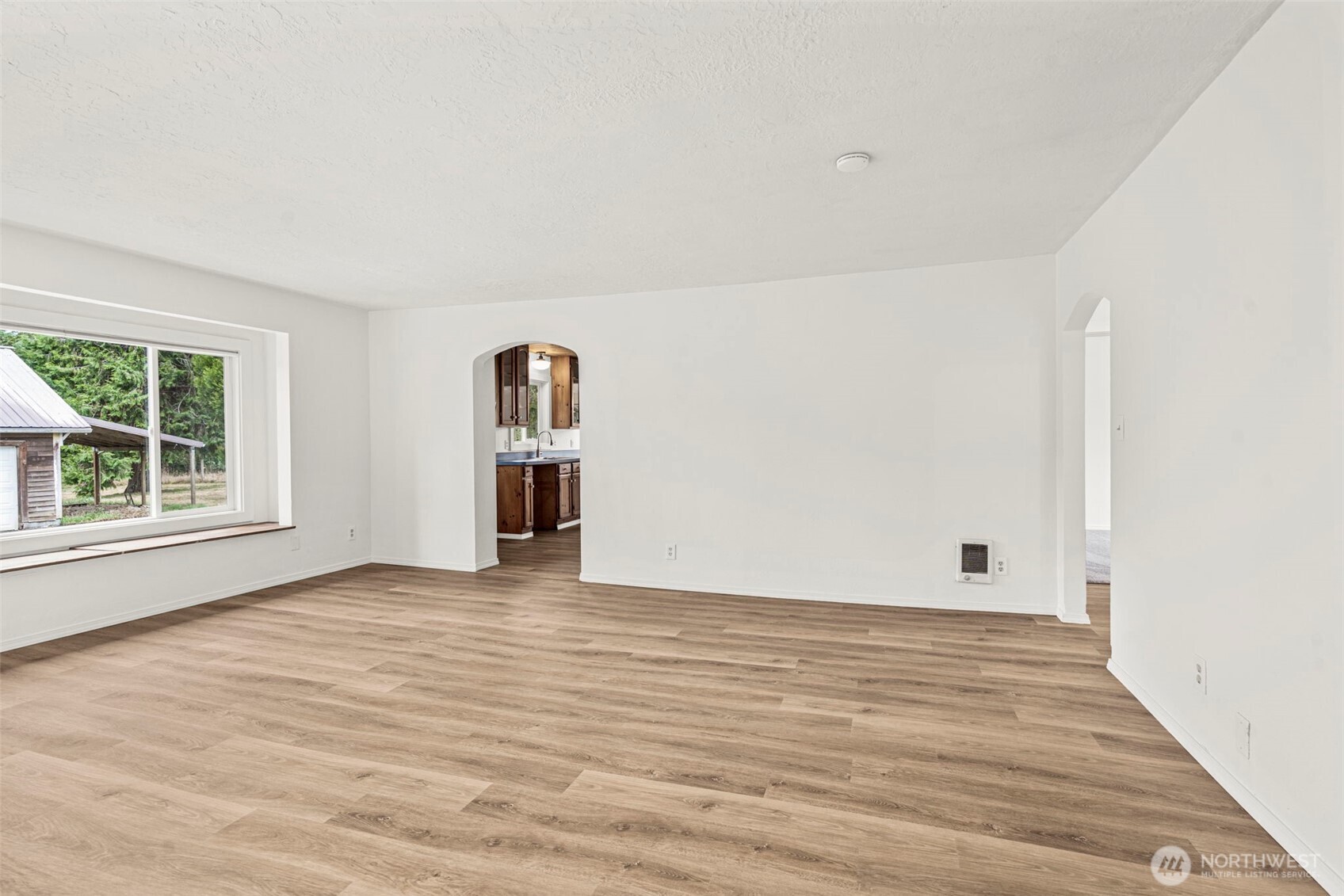 1755 Centralia Alpha Road Chehalis, WA 98532 - Photo 12 of 35 a view of empty room with wooden floor and fan
