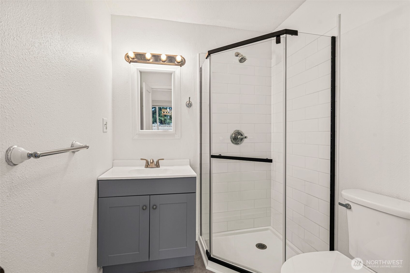 1755 Centralia Alpha Road Chehalis, WA 98532 - Photo 24 of 35 a bathroom with a shower a sink and a mirror