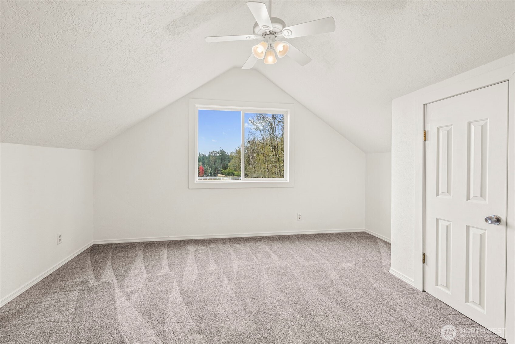 1755 Centralia Alpha Road Chehalis, WA 98532 - Photo 25 of 35 an empty room with a window and a ceiling fan