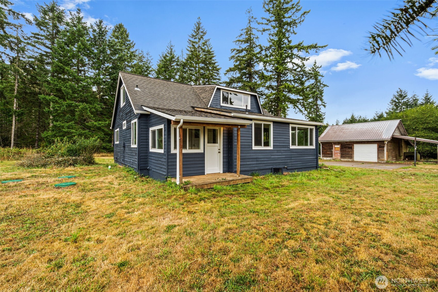 1755 Centralia Alpha Road Chehalis, WA 98532 - Photo 31 of 35 a front view of a house with a garden