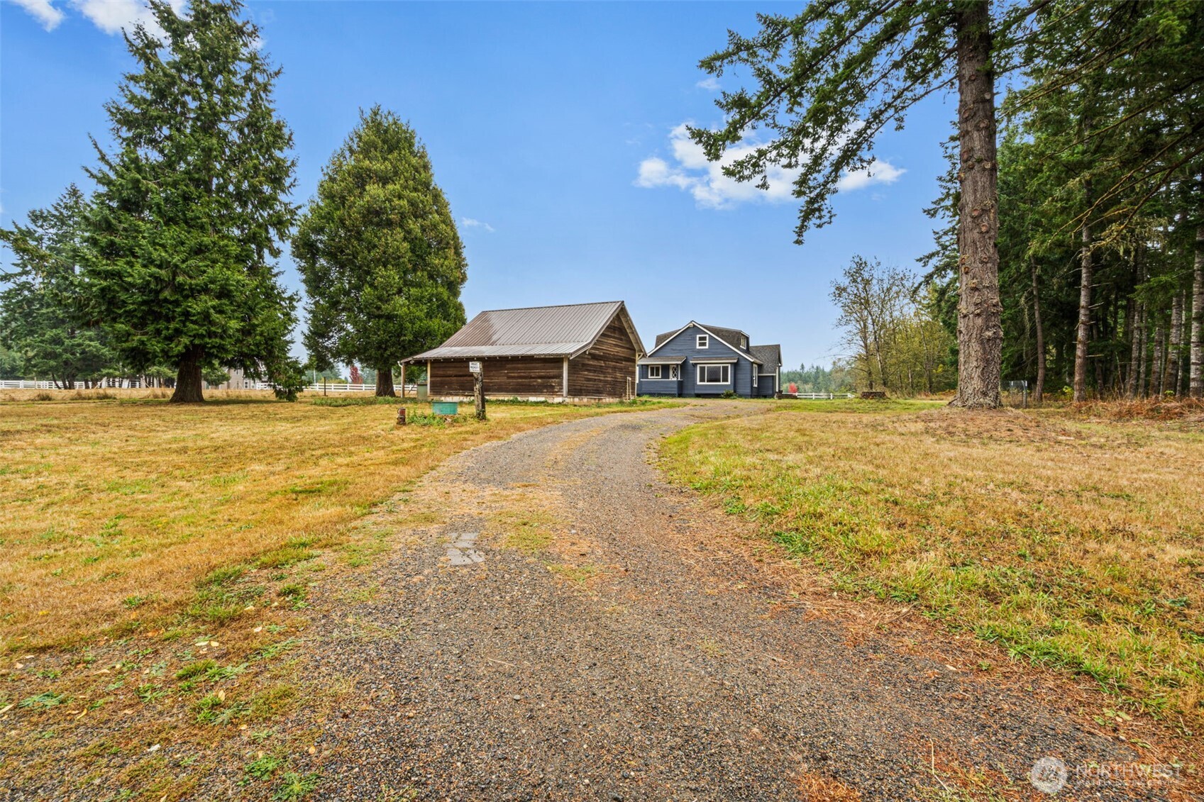 1755 Centralia Alpha Road Chehalis, WA 98532 - Photo 4 of 35 a view of a swimming pool with an outdoor space and seating area