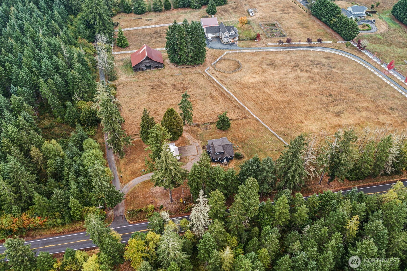 1755 Centralia Alpha Road Chehalis, WA 98532 - Photo 8 of 35 an aerial view of a house with a yard and trees