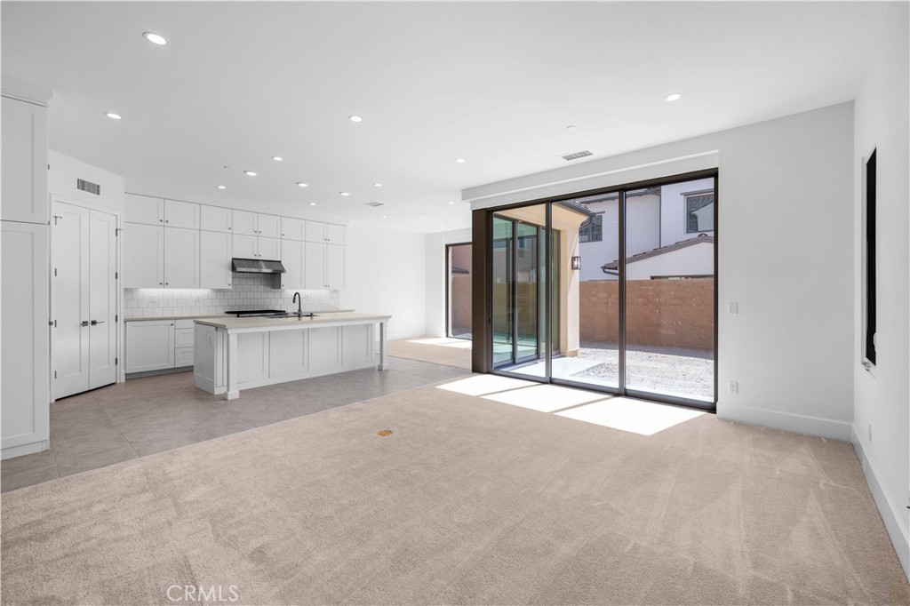220 Fiore Irvine, CA 92602 - Photo 4 of 26 a view of large kitchen with large windows