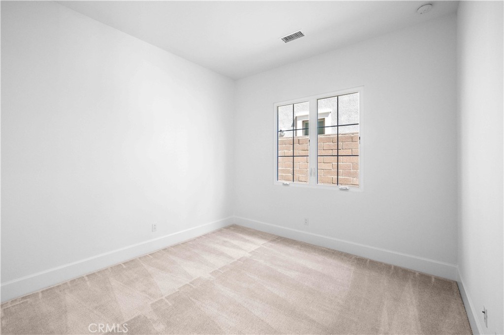 220 Fiore Irvine, CA 92602 - Photo 10 of 26 an empty room with windows