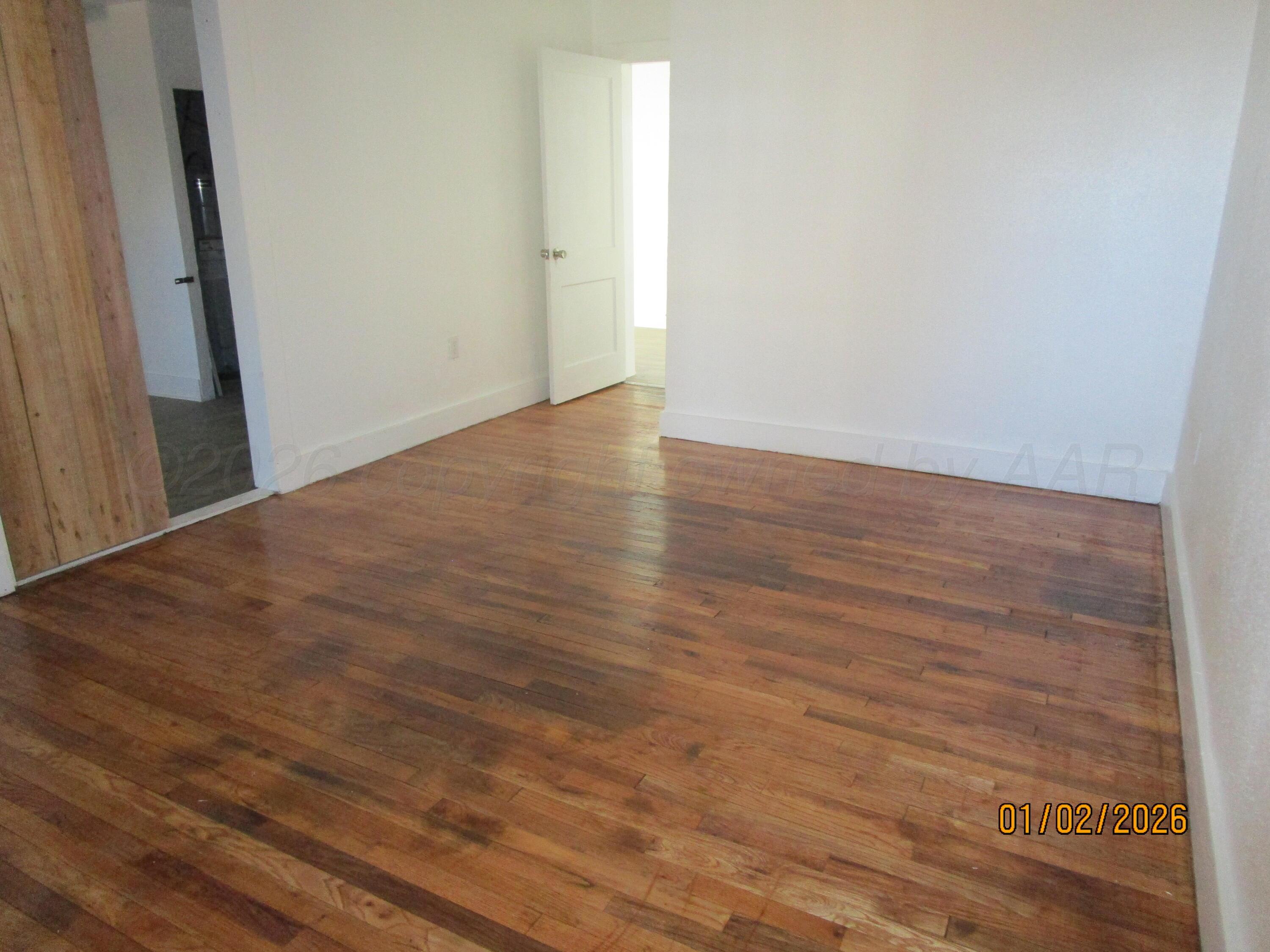 111 West Grand Street Borger, TX 79007 - Photo 2 of 6 a view of a room with wooden floor