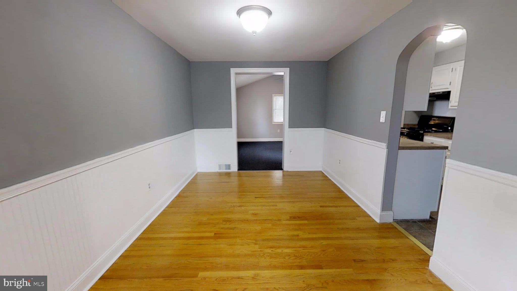 5626 Braxfield Road Baltimore, MD 21227 - Photo 5 of 23 Dining Room with beautiful chair rail
