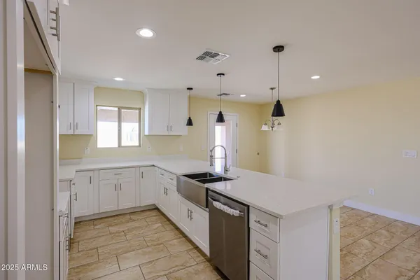 a kitchen with a sink and dishwasher