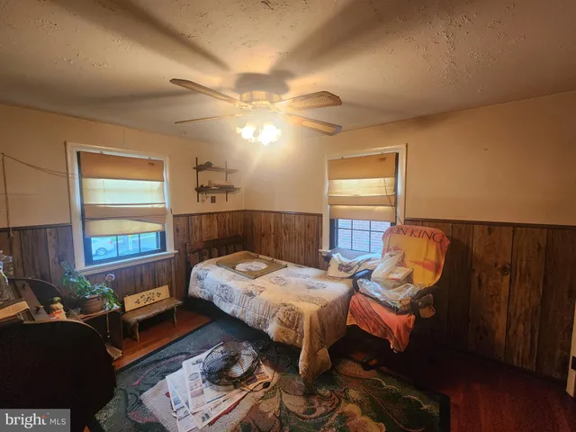 a bedroom with furniture and a window