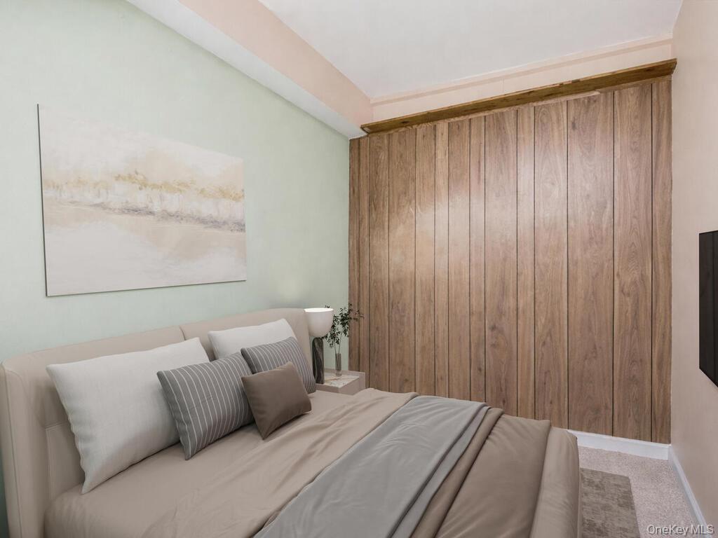 1521 Unionport Road, Unit 11A Bronx, NY 10462 - Photo 3 of 9 Carpeted bedroom featuring baseboards