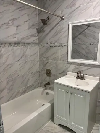 a bathroom with a sink and a bathtub